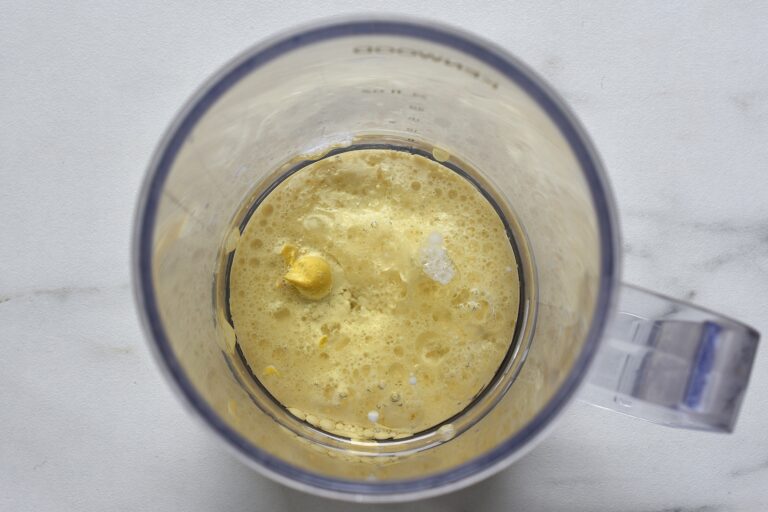 Sunflower oil, soy milk, lemon juice, mustard and salt in a blender beaker.