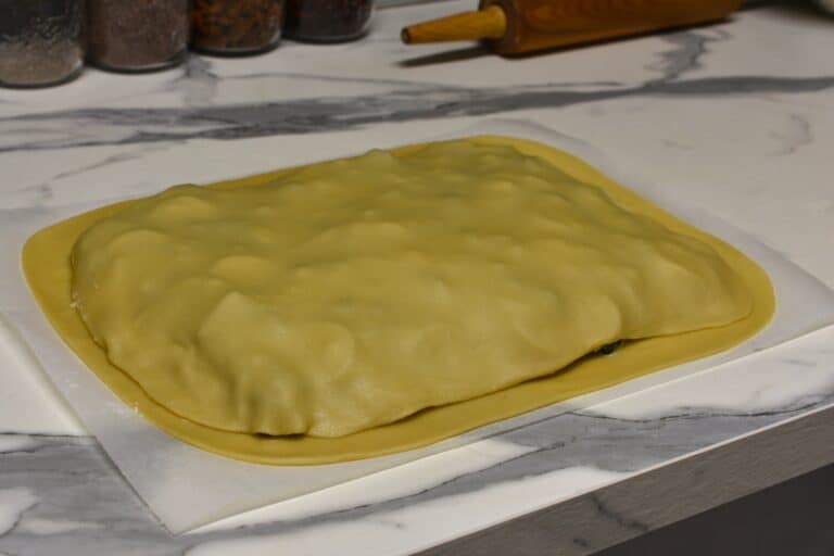 Torta verde filling between two sheets of pastry.