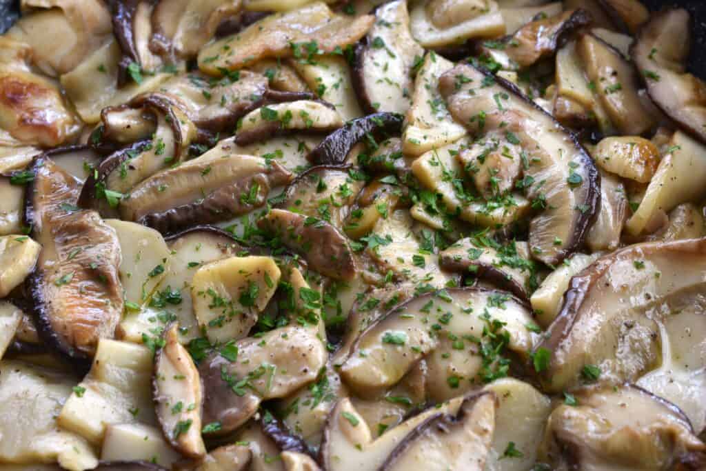 A close-up image of sautéed porcini mushrooms.