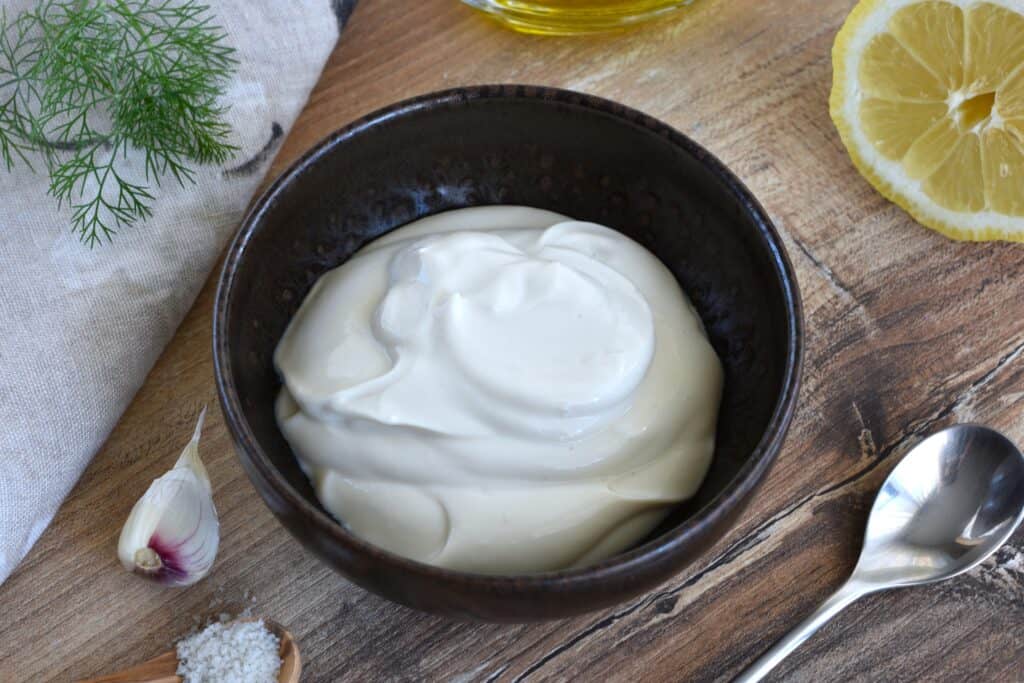 A close-up image of vegan yoghurt sauce with ingredients.