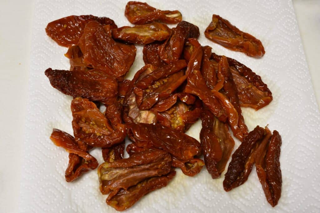 Rehydrated sundried tomatoes on kitchen paper.