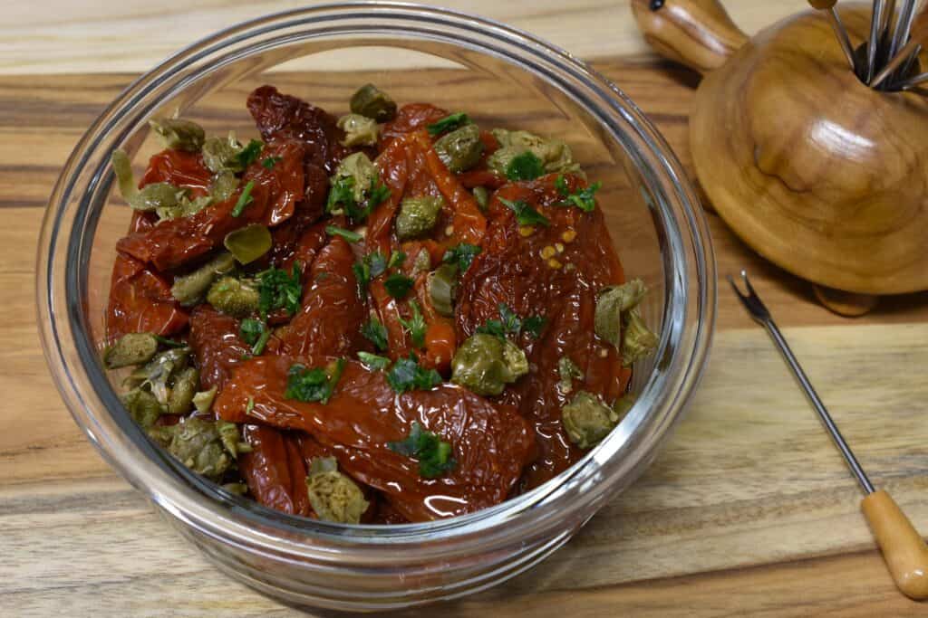 Rehydrated sundried tomatoes seasoned with oil, capers, garlic, and fresh parsley.