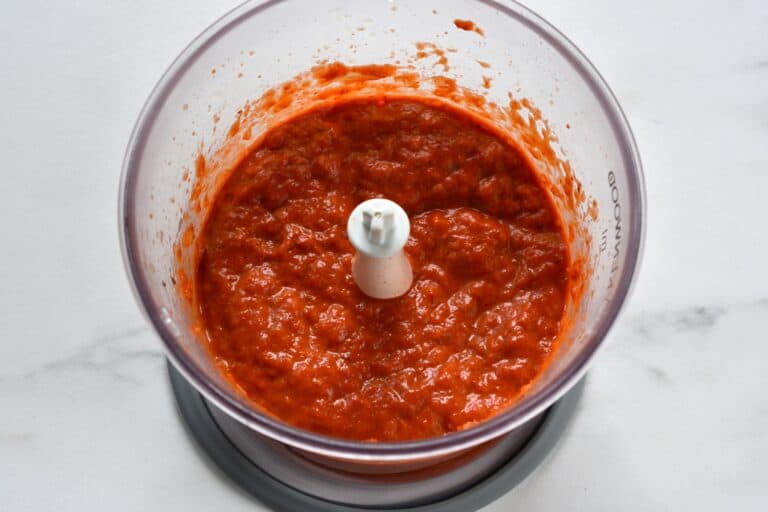 Roasted red pepper sauce in a blender.